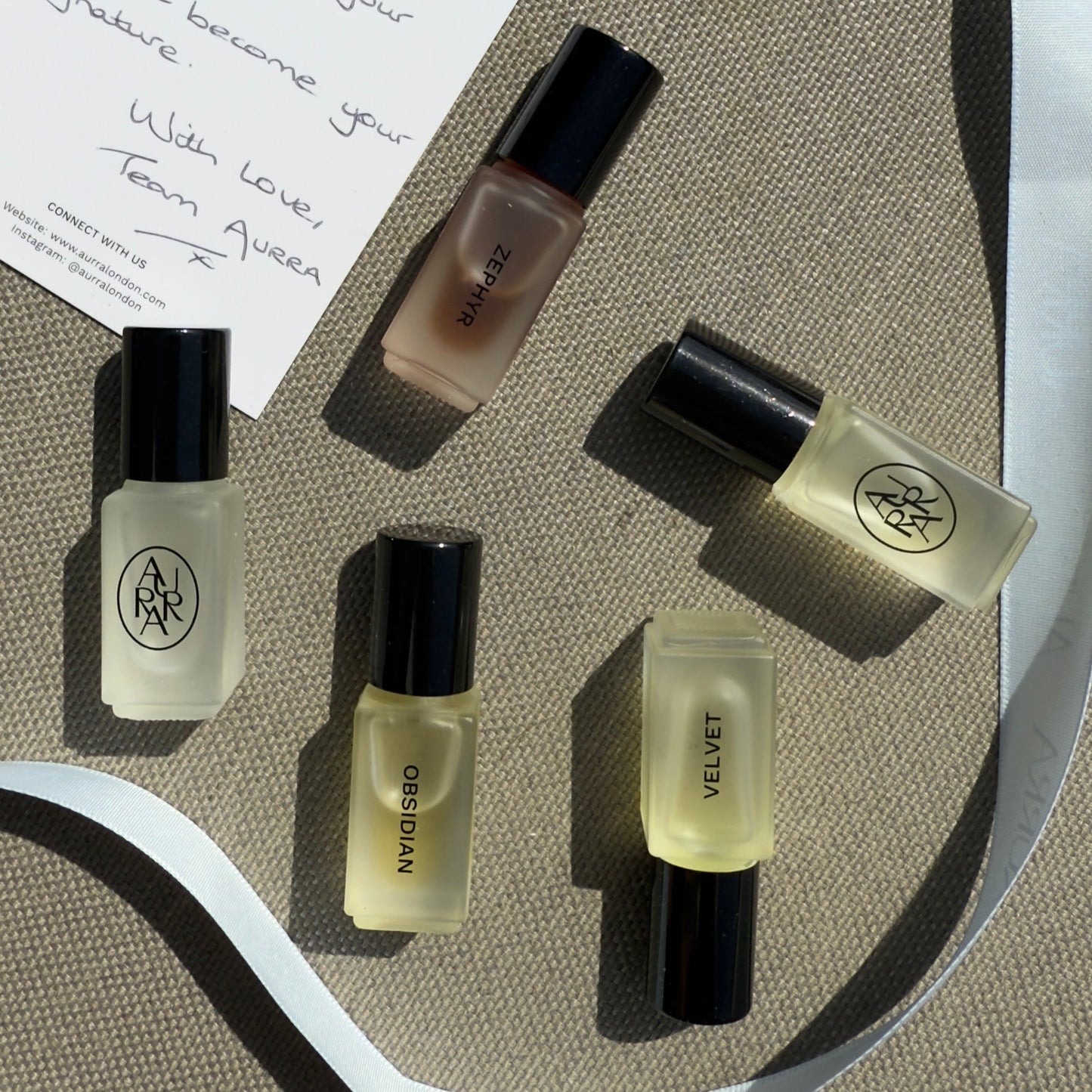 Set of AIRRA perfume oils with a handwritten note